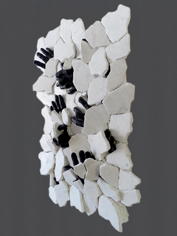 IZA, Isabelle Ardevol, woman contemporary artist, sculptress, art, Black blood under white skin sculpture, 2020. Inspired y emigration problems due to global warming. It questions equality, human rights and ethnicity. Recycled marble and resin